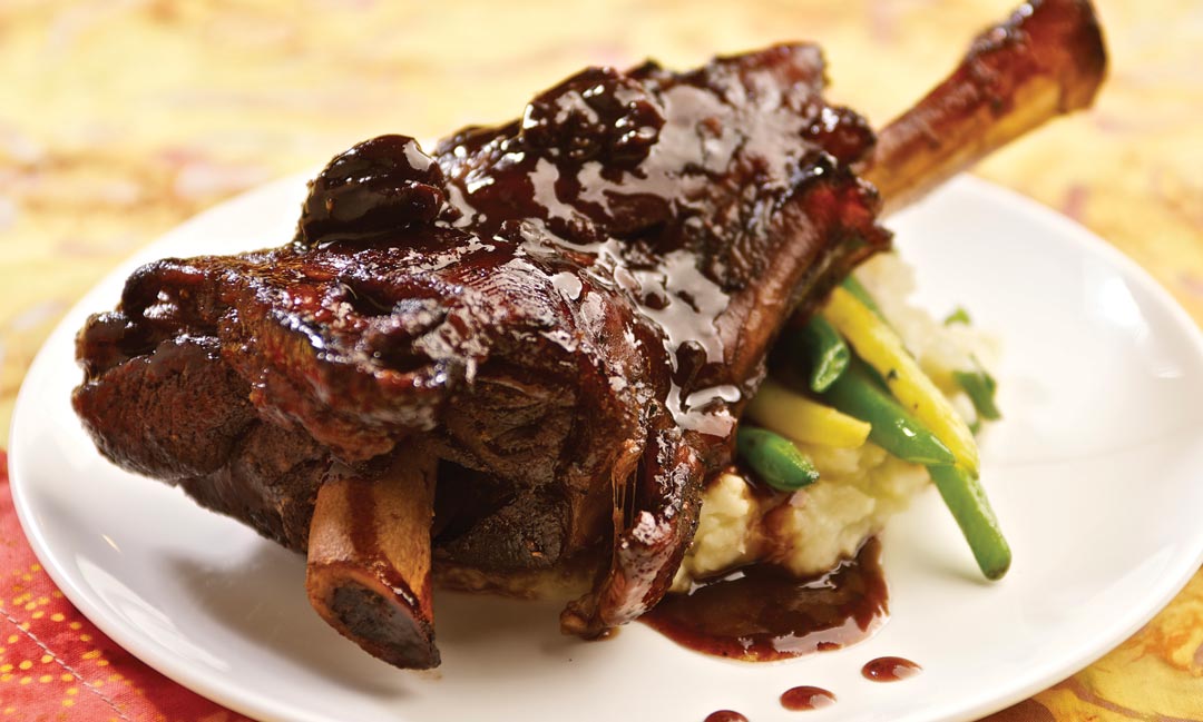 Port and Black Cherry-Braised New Zealand Lamb Shank by Chef Andy Arjoon of Billabong Bar & Bistro