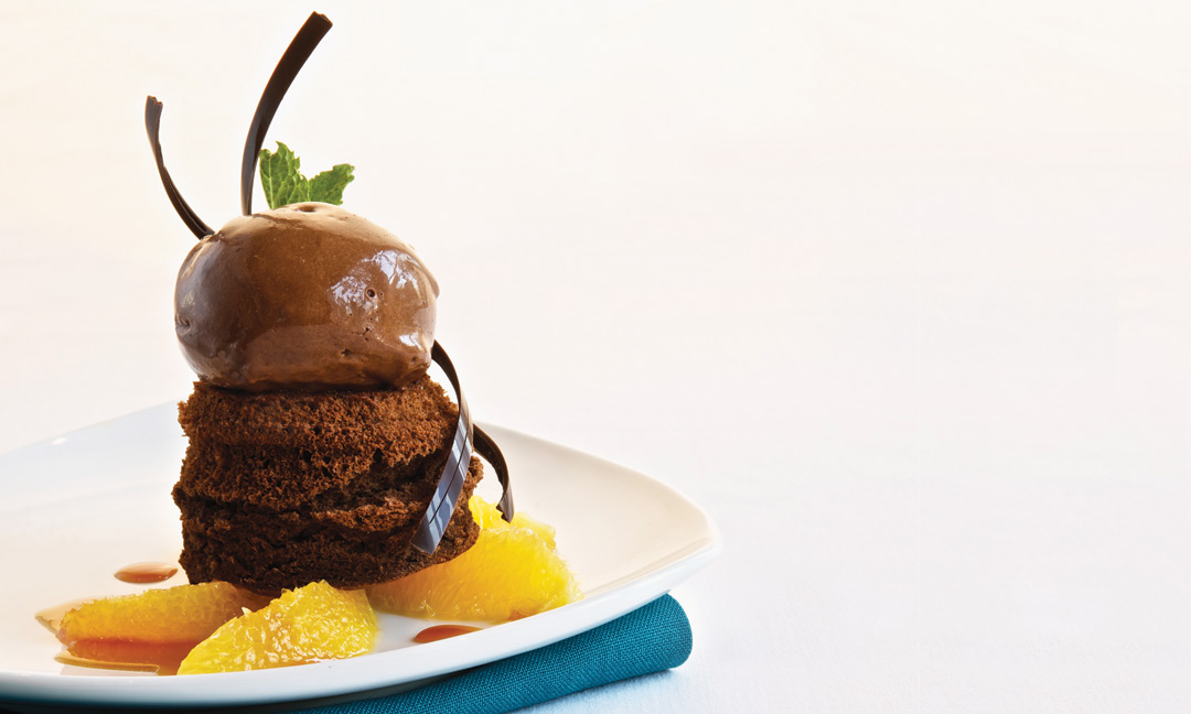 Chocolate Soufflé Cakes with Dark Chocolate Sorbet and Orange Caramel Sauce by Pastyr Chef Richard Warren of The Fort Garry Hotel