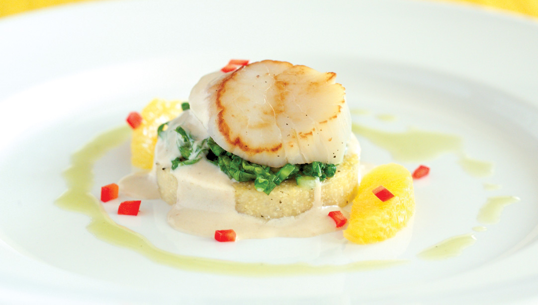 Pan Seared Diver Scallop set on Chile Flecked Polenta Crisp with Baby Bok Choy Citrus Butter Sauce by Chef Dave Bergmann of Bergmann's On Lombard